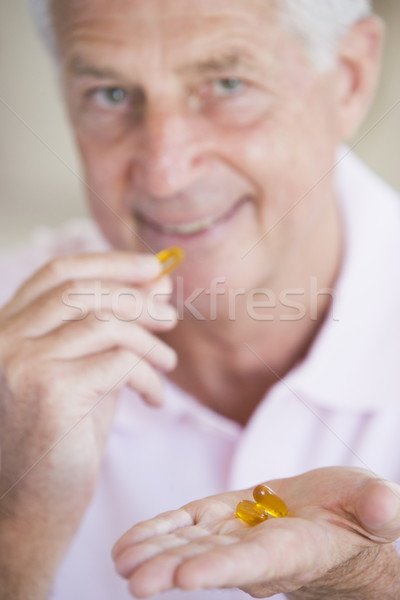 Stock photo: Man Taking Pills