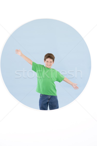 Young boy standing with arms out smiling Stock photo © monkey_business