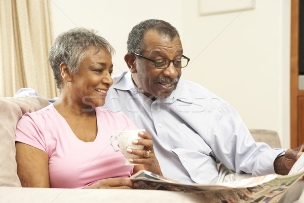 Stock photo: Senior Couple Reading Newspaper At Home