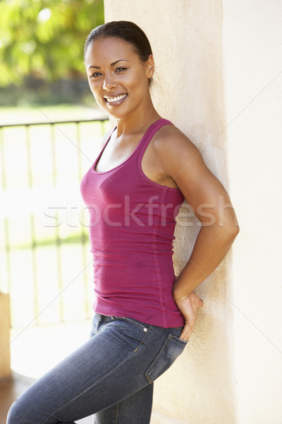 Young Woman Leaning Against Pillar Stock photo © monkey_business