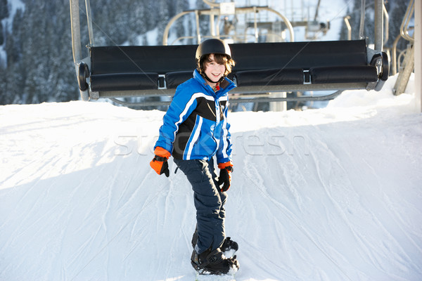 Young Boy Getting Off chair Lift On Ski Holiday In Mountains Stock photo © monkey_business