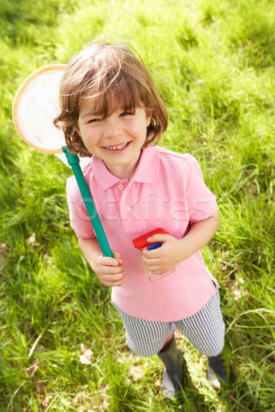 Young Boy In Field With Net And Bug Catcher Stock photo © monkey_business