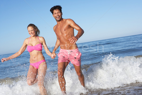 Couple Enjoying Beach Holiday Stock photo © monkey_business