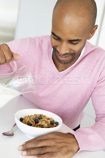 Középkorú férfi egészségesen enni reggeli otthon eszik mosolyog Stock fotó © monkey_business