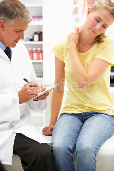 Doctor with female patient Stock photo © monkey_business