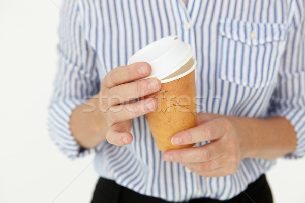 Businesswoman holding takeout coffee Stock photo © monkey_business