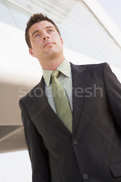 Businessman standing outdoors by building Stock photo © monkey_business