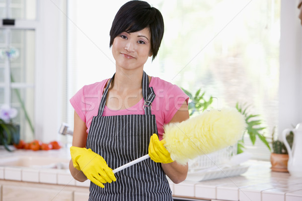 Woman Holding Duster And Wearing Rubber Gloves Stock photo © monkey_business