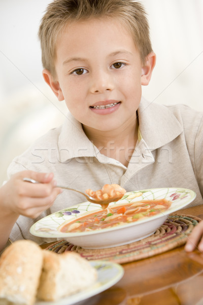 Young boy indoors eating soup Stock photo © monkey_business