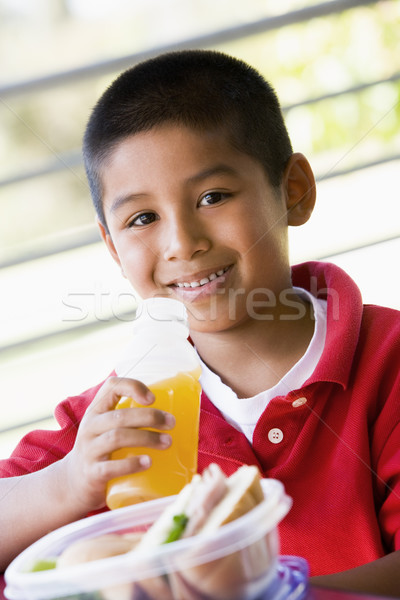 Boy eating lunch at kindergarten Stock photo © monkey_business