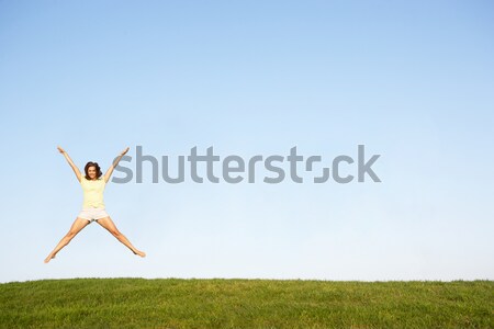 Young woman  jumping in air Stock photo © monkey_business
