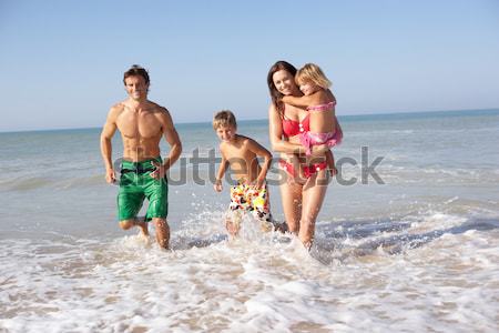 Teenagers playing on beach Stock photo © monkey_business