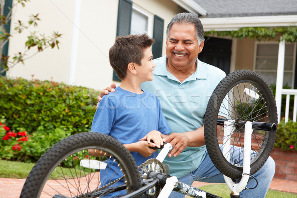 boy and grandfather fixing bike Stock photo © monkey_business