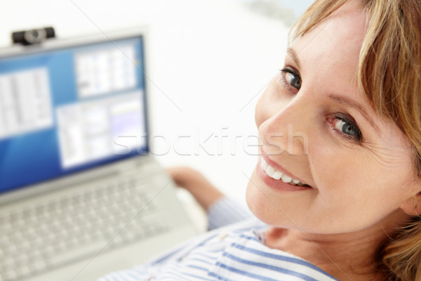 Mid age businesswoman using laptop Stock photo © monkey_business