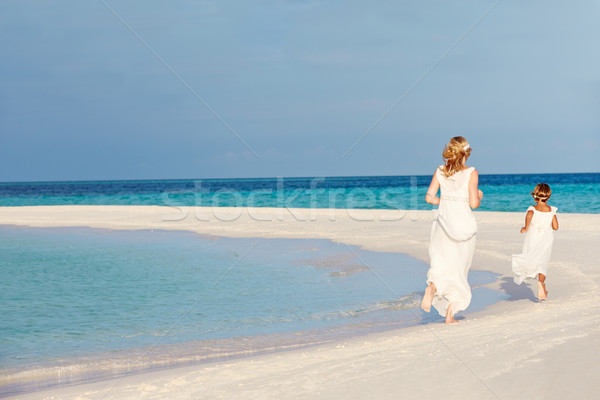 Bride With Bridesmaid At Beautiful Beach Wedding Stock photo © monkey_business