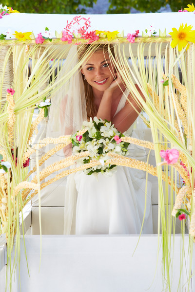 Bride Sitting Under Decorated Canopy At Wedding Stock photo © monkey_business