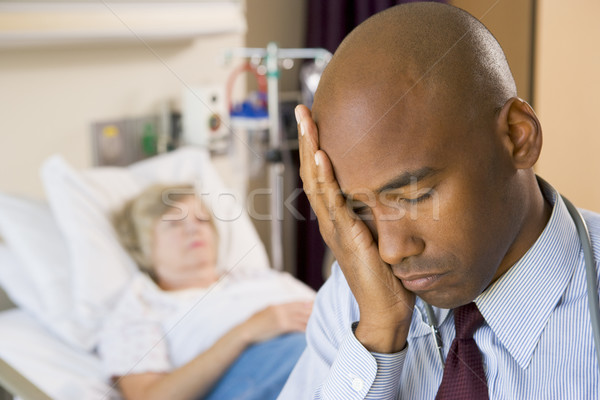 Doctor Looking Tired And Frustrated In Hospital Room Stock photo © monkey_business