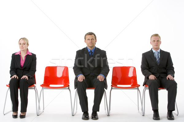 Három üzletemberek ül piros műanyag üzlet Stock fotó © monkey_business