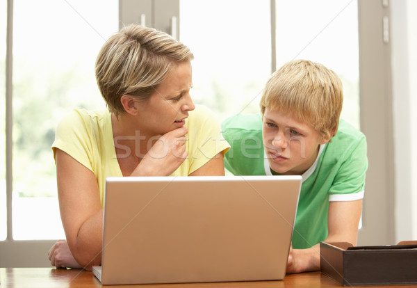 Mother And Teenage Son Using Laptop At Home Stock photo © monkey_business