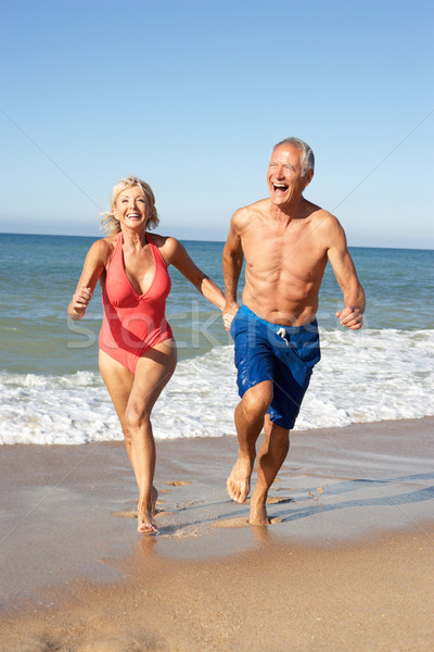 Senior Couple Enjoying Beach Holiday Stock photo © monkey_business