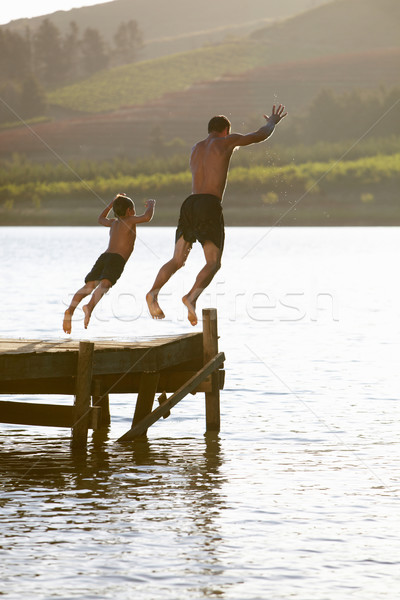 Stockfoto: Jonge · man · kind · springen · water · handen · man