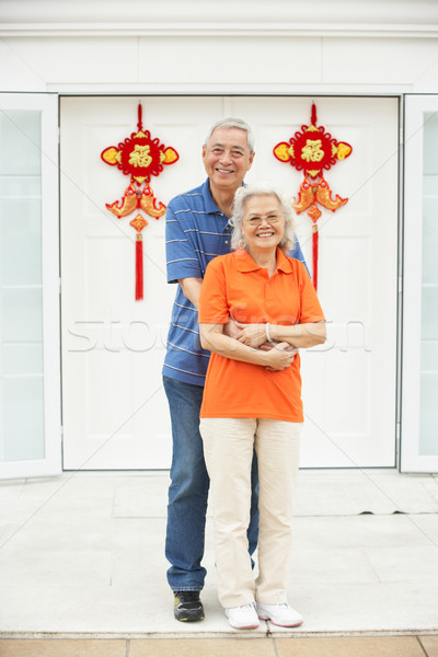 Senior Chinese Couple Outside Home Decorated With Welcoming Feng Stock photo © monkey_business