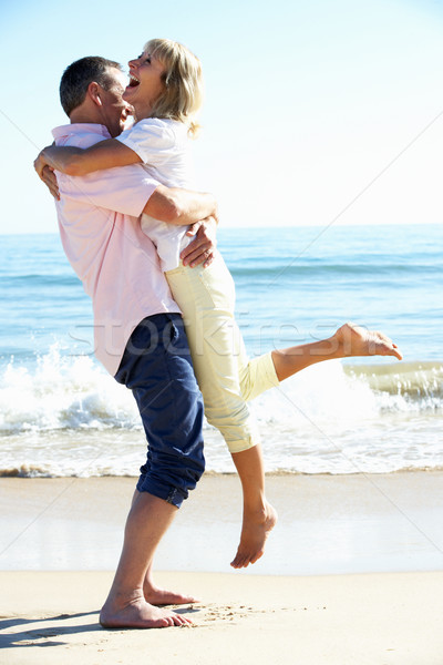 Senior Couple Enjoying Romantic Beach Holiday Stock photo © monkey_business