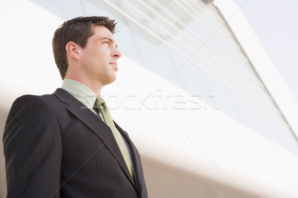 Businessman standing outdoors by building Stock photo © monkey_business