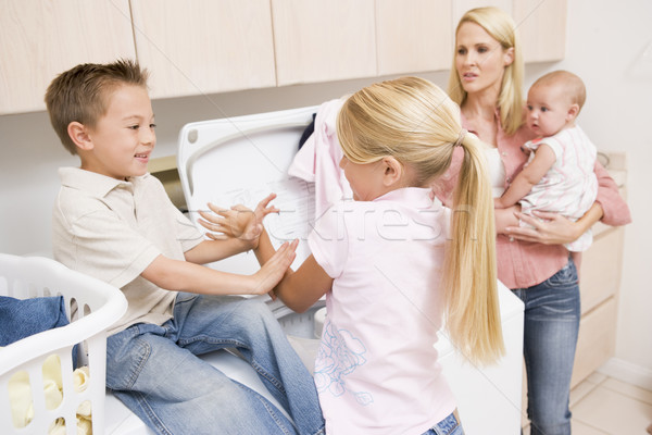 Siblings Fighting While Doing Laundry  Stock photo © monkey_business