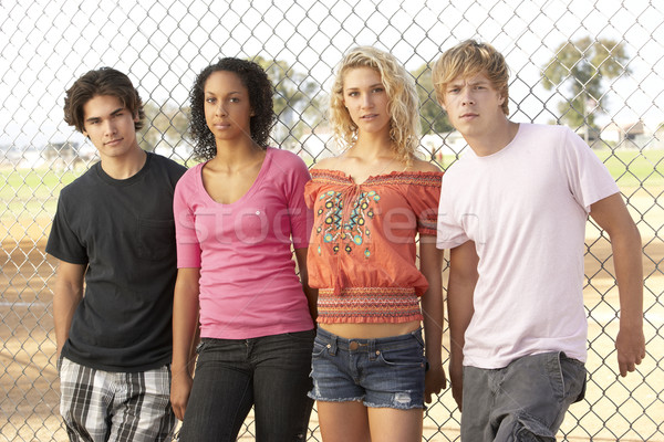 Group Of Teenagers Sitting In Playground Stock photo © monkey_business
