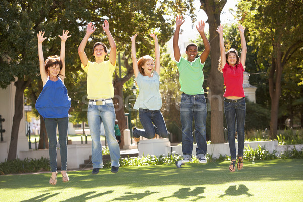 Group Of Teenagers Jumping In Air In Park Stock photo © monkey_business