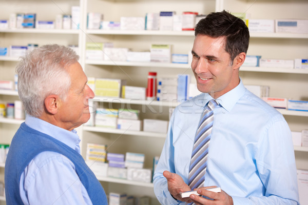 UK pharmacist serving  senior man in pharmacy Stock photo © monkey_business