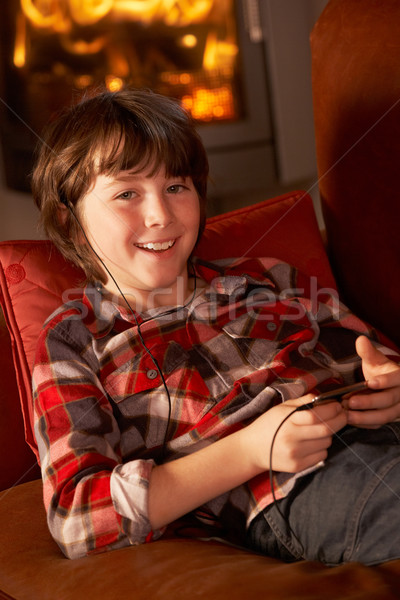 Młody chłopak relaks mp3 player ognia szczęśliwy Zdjęcia stock © monkey_business