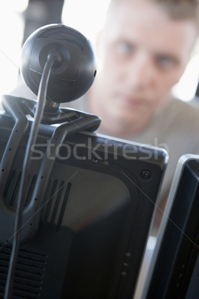 Shot of a man behind a computer and web camera Stock photo © monkey_business