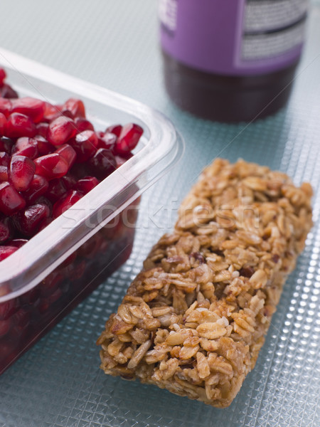 Pomegranate Seeds With A Cereal Bar And Berry Smoothie Stock photo © monkey_business