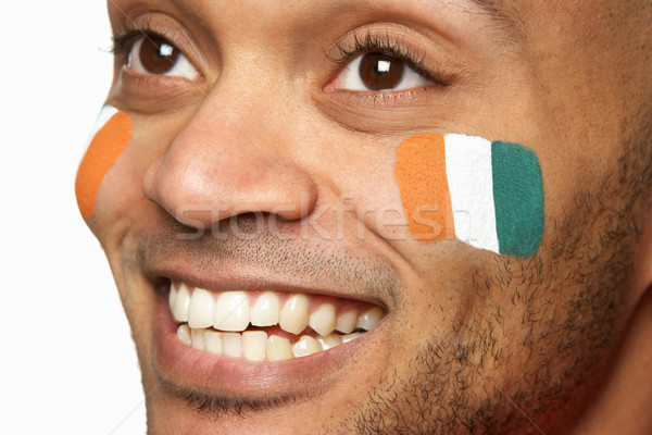 Young Male Sports Fan With Ivory Coast Flag Painted On Face Stock photo © monkey_business