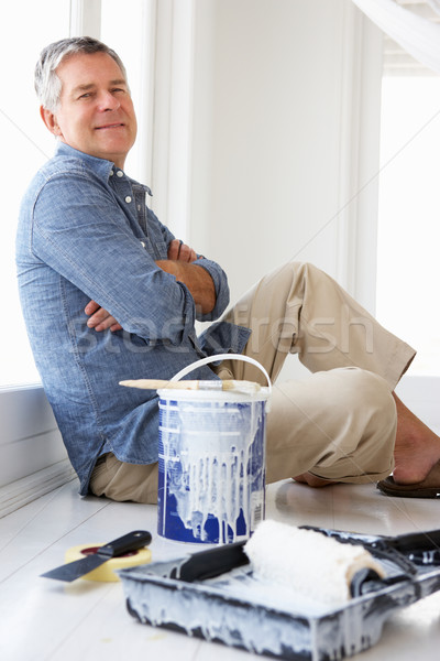 Senior man decorating house Stock photo © monkey_business