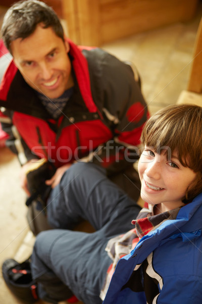 Father Helping Son To Put On Warm Outdoor Clothes And Boots Stock photo © monkey_business