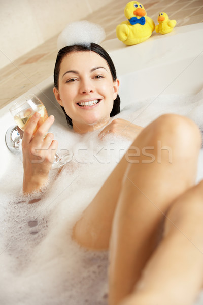 Woman Relaxing With Glass Of Wine In Bubble Filled Bath Stock photo © monkey_business