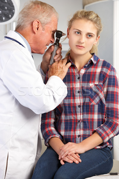 Doctor Examining Teenage Girl's Ears Stock photo © monkey_business
