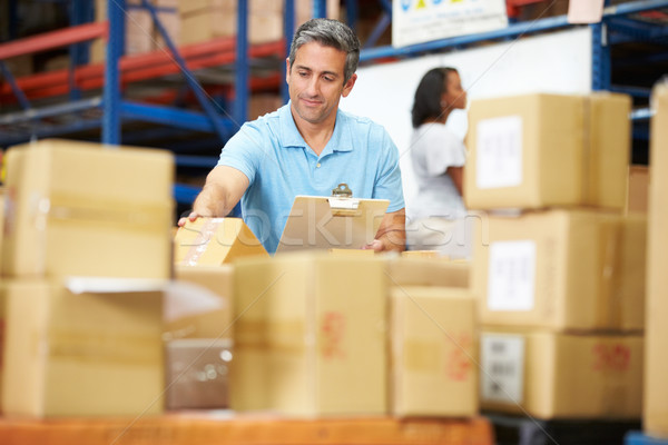 Workers In Warehouse Preparing Goods For Dispatch Stock photo © monkey_business