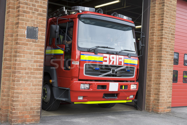 Stock photo: A fire engine leaving the fire station