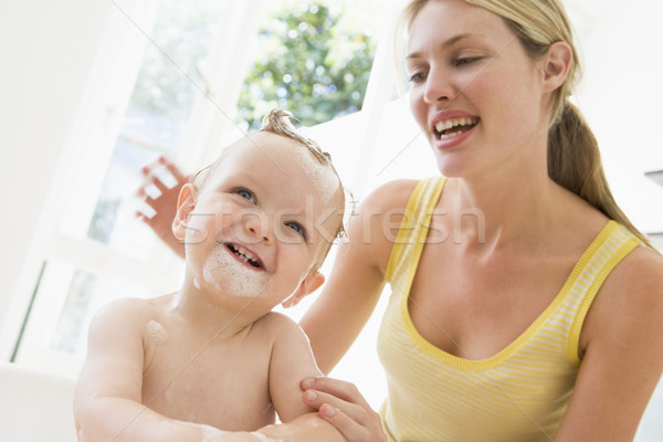 Anya baba habfürdő mosolyog nő gyermek Stock fotó © monkey_business
