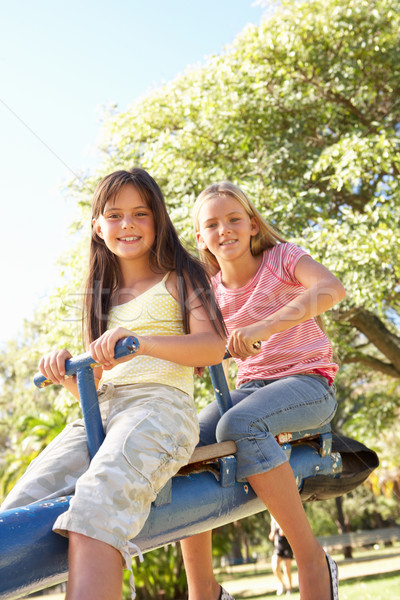 Deux filles équitation voir vu aire de jeux [[stock_photo]] © monkey_business