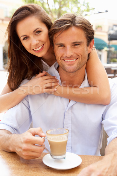 Young Couple Enjoying Coffee And Cake In Caf Stock photo © monkey_business