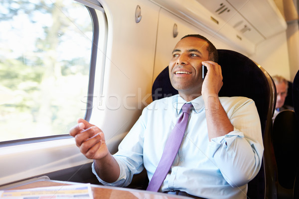 Zakenman woon-werkverkeer werk trein mobiele telefoon man Stockfoto © monkey_business