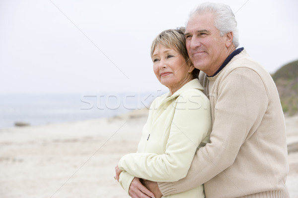 Pár tengerpart átkarol mosolyog nő szeretet Stock fotó © monkey_business