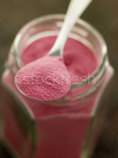 Stock photo: Spoon of Sel Rose on a Glass Jar