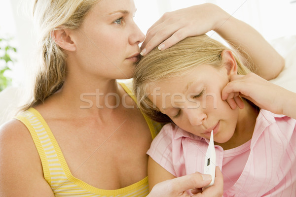 Girl Having Her Temperature Measured Stock photo © monkey_business