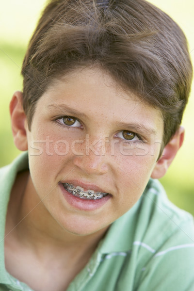 ストックフォト: 子供 · 肖像 · 少年 · 幸せ · 笑みを浮かべて · ブレース